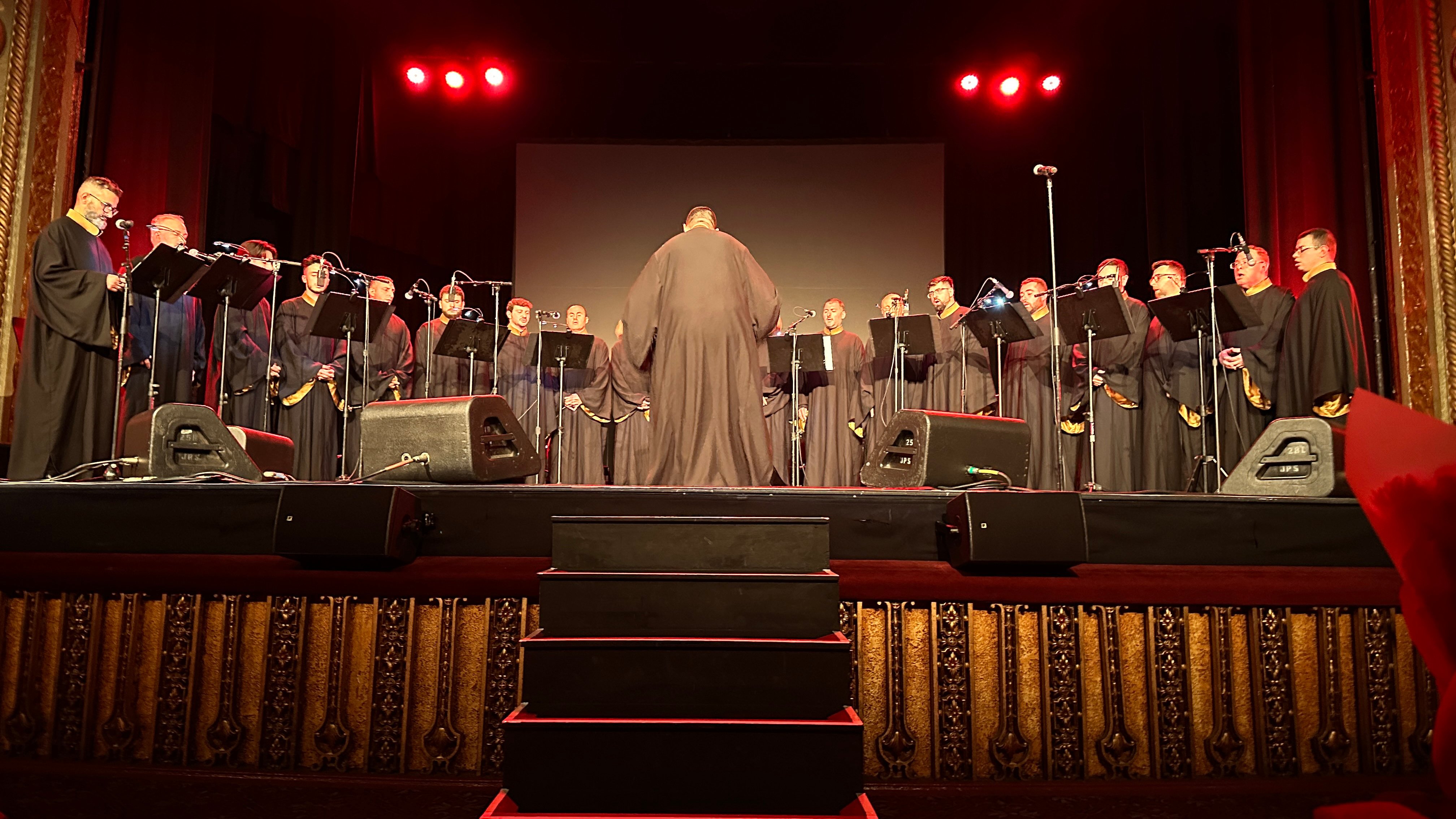 The Choirmaster conducting the ensemble